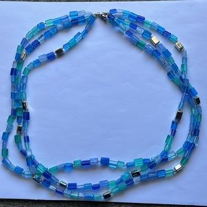 Triple-strand necklace of blue, aqua, green, silver plastic beads